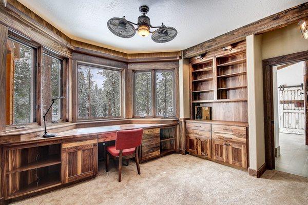 A striking walnut office designed by Cabinets by Sun Ray. General Contractor: Jirsa Construction