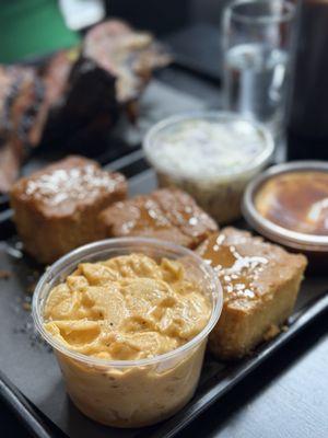 Mac and cheese, cornbread, coleslaw, and sauce