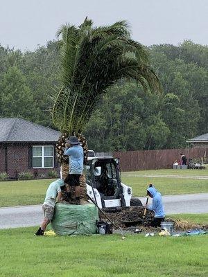 Still digging in the downpour.