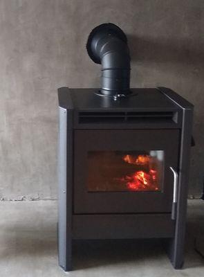 Installation of Blaze King Chinook 20 wood stove on concrete hearth.