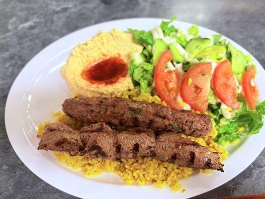 Steak kabob with kofta kebab. Homemade hummus, rice, house dressing salad. Comes with hot pita bread too!