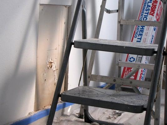 Hole cut in wall where mold was growing in Alta by Domain apartment, owned by Riverstone Residential Group.