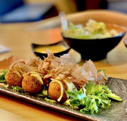 Takoyaki !!! Side salad with Ginger dressing in back. Both fabulous. OuiOui :)....