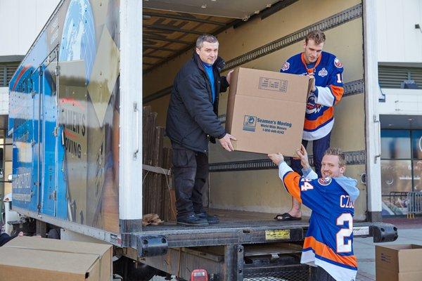 With the Bridgeport Sound Tigers Hockey players.