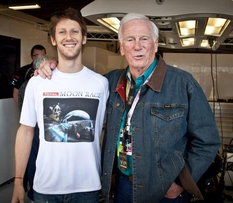 Here is a pic of Lotus Team driver wearing one of the t-shirts that I printed for them. He is standing with Gene Cernan.