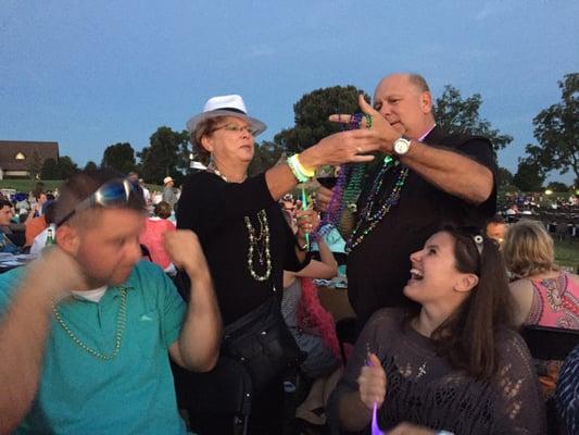 Kris and Michelle receiving their beads... In true Mardi Gras fashion