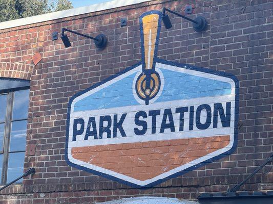 Park station sign pained on brick