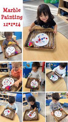 A glimpse into our holiday themed festivities from our curriculum. These friends are using their gross motor skills to create art!