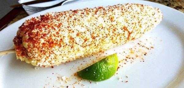 Our famous corn on the cob!! Mayo, Cotija cheese, chili powder and a lime.