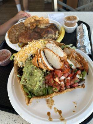 Papa charo plate in back and chicken Spicy Tostada Salad