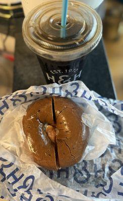 Toasted pumpernickel bagel with butter and lox, and a nitro cold brew