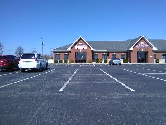 Enter the doors under the State Farm sign.