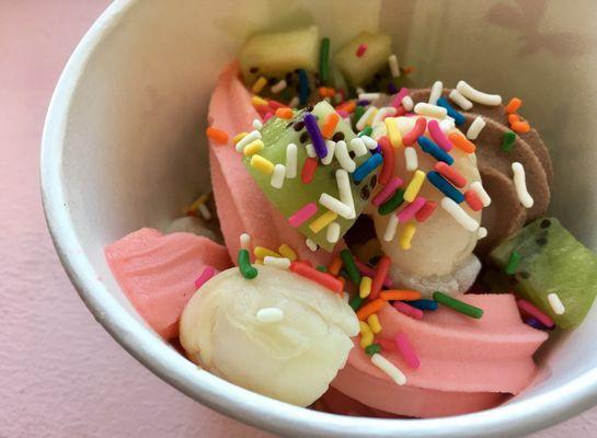 Strawberry, lemonade, chocolate frozen yogurt with lychee, kiwi, mochi, and rainbow sprinkles. lol