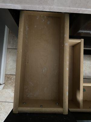 Toothpaste and other residue in the vanity drawer