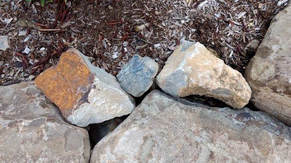 Messy looking boulder wall, complained numerous times and still not corrected.