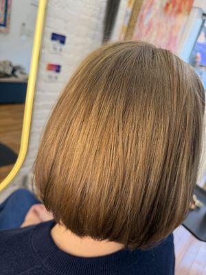 A vegan golden medium blonde color used to balance uneven tones