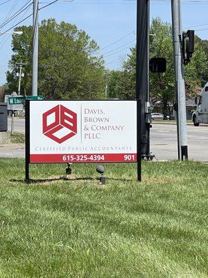 Post and panel sign with a painted aluminum frame