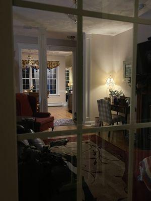 Photo taken by the front door of the foyer and dining room beyond.