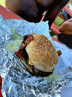 Reef burger added bacon.. it didn't come with any mayo or ketchup or mustard..just a dry burger with toppings