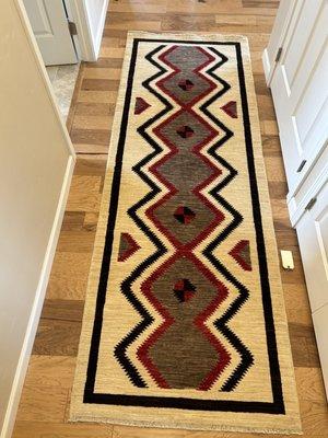 This is a hand knotted rug from Afghanistan from a Navaho design.