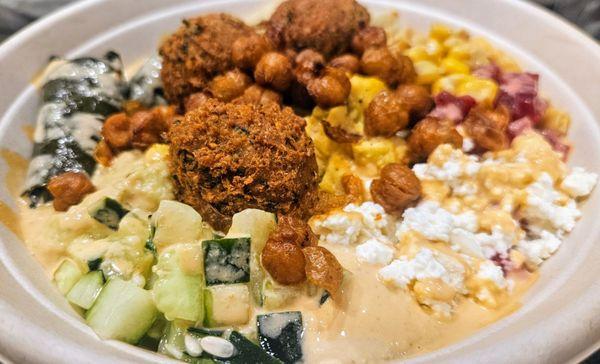 Build Your Own Bowl - couscous, roasted eggplant hummus, tzatziki, falafel, cucumber, corn, feta