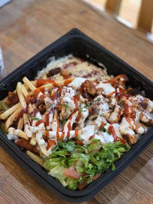 Chicken shawarma plate. Has some spice to it (red sauce)