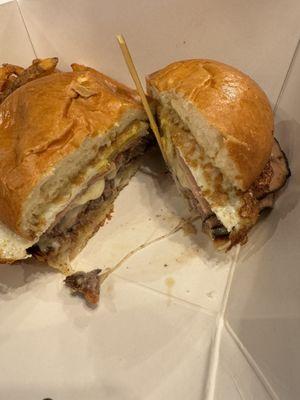 Inside the farm burger! Ham, bacon, fried egg, mixed cheeses, an all American beef patty, mayo and I added a splash of mustard.