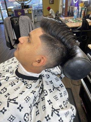 Taper fade combover with a 1 on the sides and a lineup