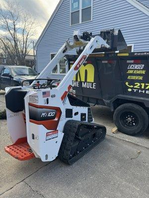 Loading some wood stumps and green waste