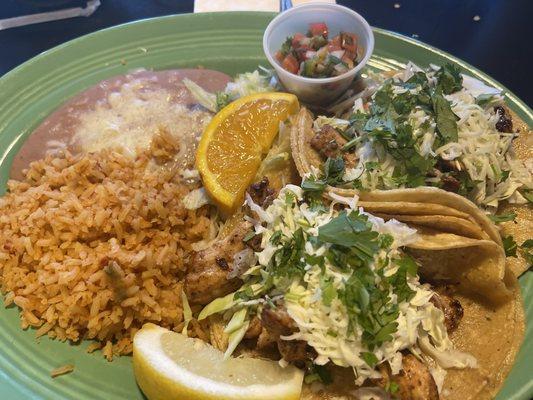 Grilled chicken tacos, rice and beans.