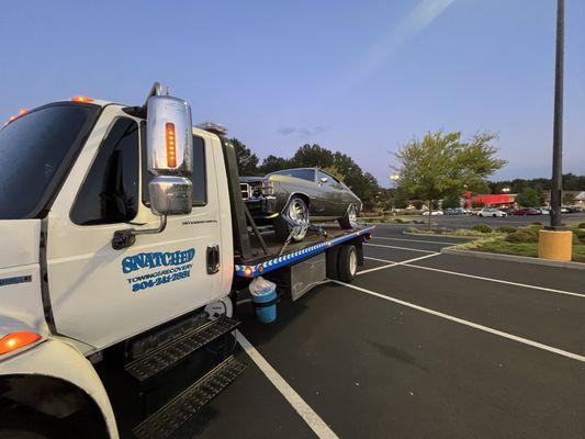 Custom vehicle towed with extreme care.