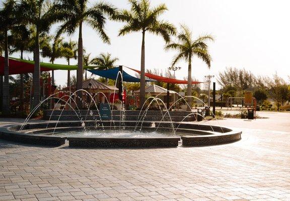 Playground with baptismal fountain in the front view.