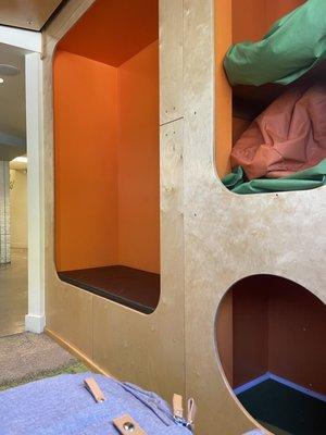 Sweet seating and storage/play area while you wait.