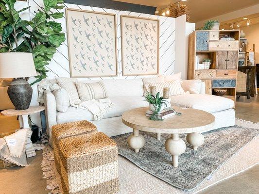 Slipcover sectional sofa, artwork, unique coffee table, furniture market samples