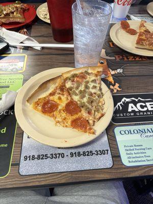 Pepperoni pizza and sausage pizza and sprite