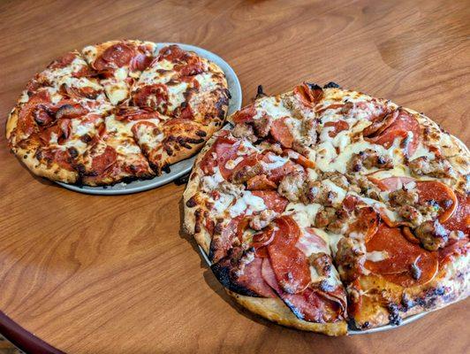 All meat pizza, foreground, New Yorker, background.