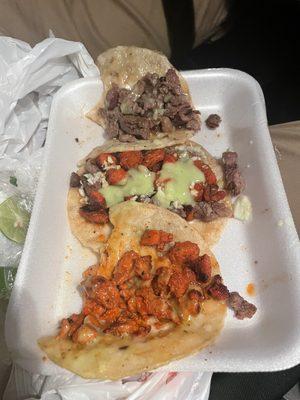 Carne asada (beef) taco and carne adobada (pork) taco. We got it with cheese and plain, but normally they have additional toppings