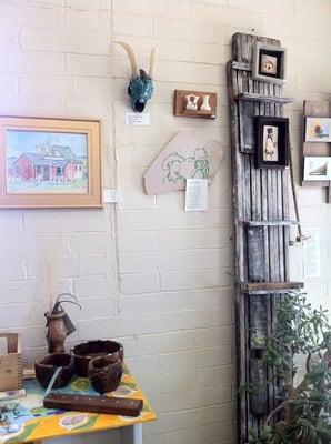 Turquoise studded skulls and drawings and pottery.