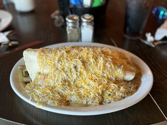 Gargantuan breakfast burrito. Salt and pepper shakers for comparison