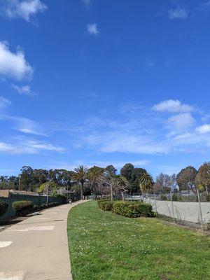 Fairly green this time of year plus a little creek. I saw a husky and two french pugs during a quick stroll. There's a dog park nearby.