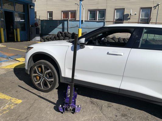 Getting a tire repaired after driving over a screw.