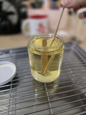 Stirring in wax and scent oil