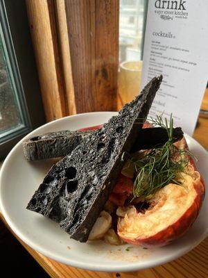 Cioppino (seafood stew) with squid ink bread