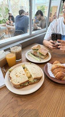 Lox Sandwich, Chicken Pesto Sandwich, Orange Juice, Almond Croissant, Vanilla Iced Latte
