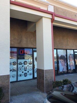 They're re painting the complex so currently no sign on building. Next to hair dresser.