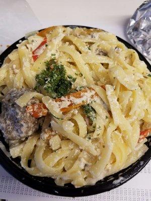 BLAND, watered down, not creamy, unseasoned garlic alfredo with dry meatball.