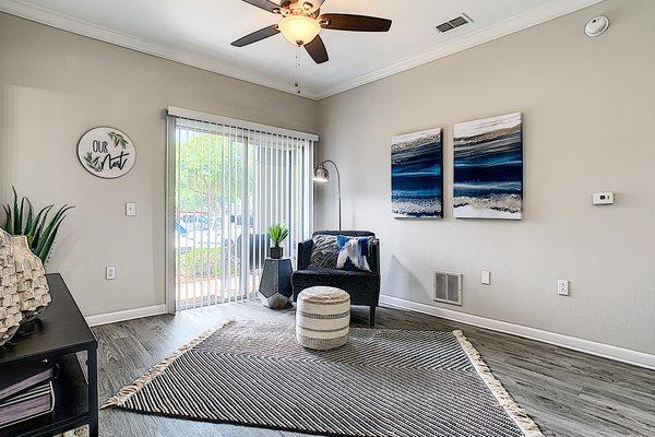 Spacious living rooms featuring wood-style flooring.