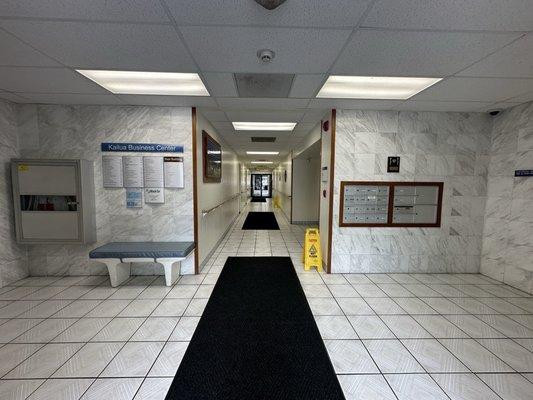 Here's the entrance to the building on the first floor. Take the elevators on the left or right when you enter to go up to the third floor.