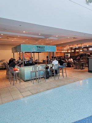 Photo of business. Immediately on right is BurgerFi