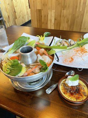 Hot pot with added ingredients and crème brûlée on the side